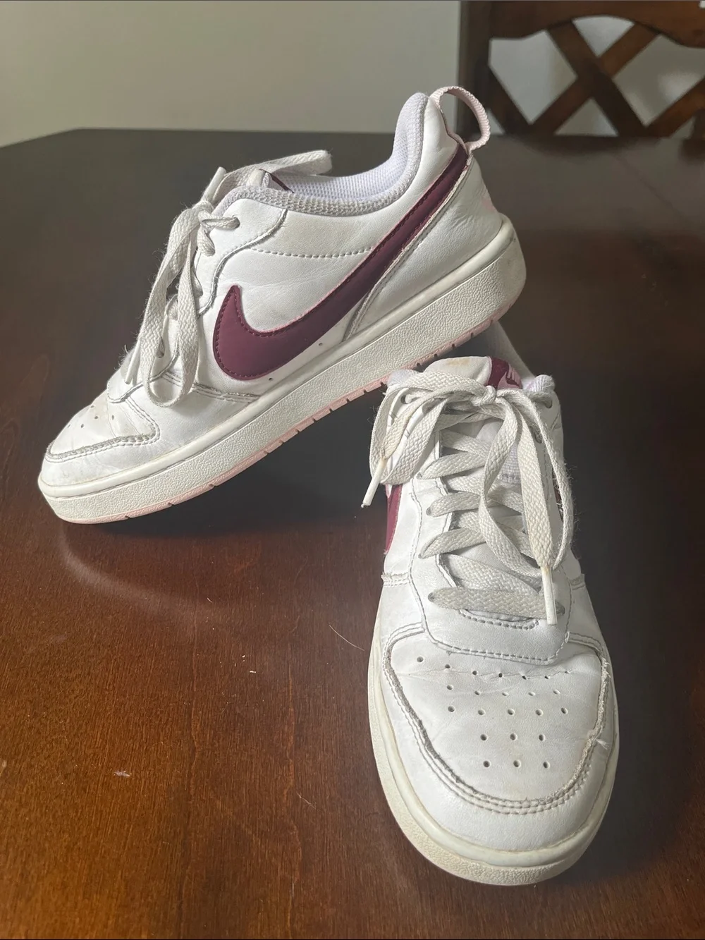 Nike Kids White Sneakers with Maroon Swoosh and Light Pink Details